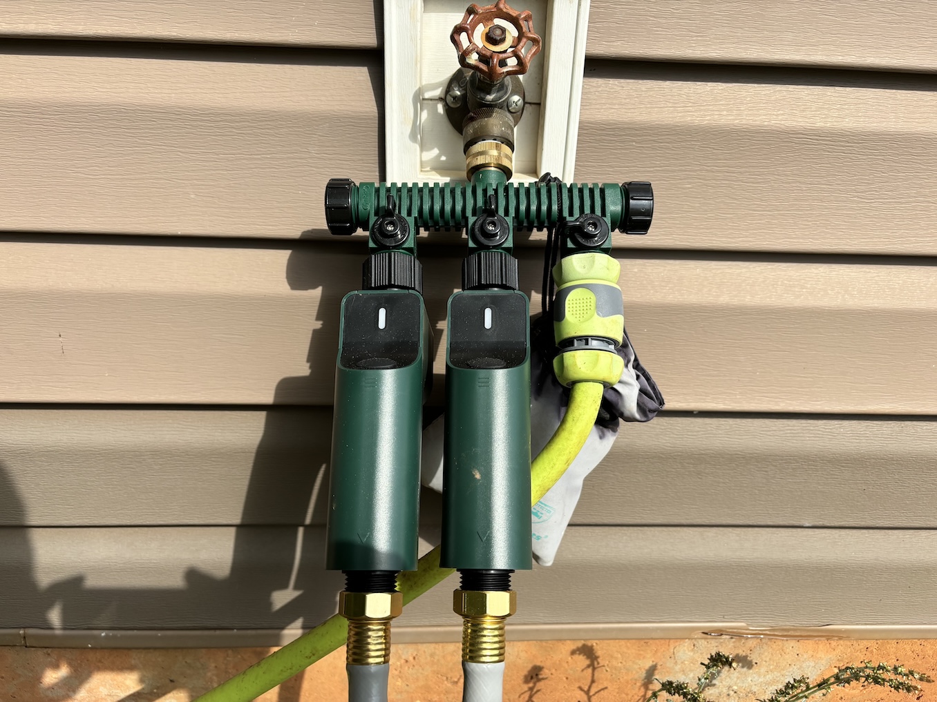 Sprinkler timers attached to a manifold